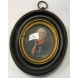 A 19th Century miniature of a decorated gentleman with red collar, sash and medals,