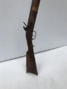 A Jukar muzzle loading black powder shotgun flintlock 32.