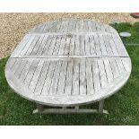 A slatted teak D end garden table 120 x 181 cm