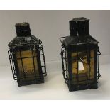 A pair of Victorian painted metal hanging ships style lanterns set with amber coloured glass panels