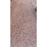 A length of pink and black granite,