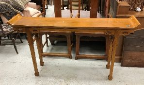 A 20th Century Chinese elm altar-style side table with scroll-work carved decoration on square