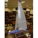 A plastic bodied pond yacht on stand,