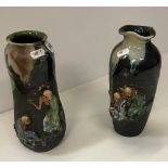 Two Japanese Sumida Gawa vases with typical figural relief decoration and slip glazes, 25 cm and 24.