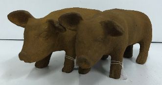 Two modern cast iron Pigs with rust effect finish,