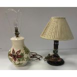 A modern Moorcroft table lamp of baluster form with cream ground and floral decoration,