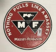 A painted cast metal sign "Nothing Pulls Like a Massey - Massey Ferguson"