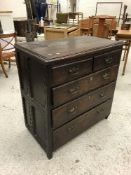 An 18th Century oak chest of two short over three long drawers on stile supports,