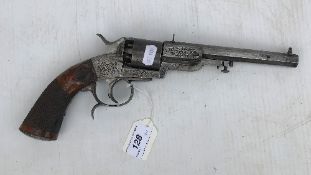 A 19th Century I Funk & Co six shot revolver with engraved metalwork and hatch carved walnut grip