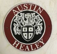 A modern painted cast metal sign "Austin Healey",