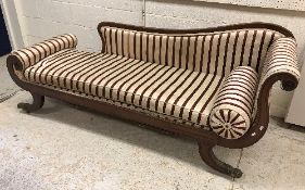 A 19th Century mahogany framed scroll arm chaise longue in the Regency style,