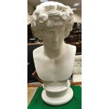 A white painted plaster bust of Dionysus on a socle base (larger than life),