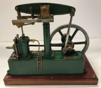 A Stuart Turner stationary live steam beam engine with single fly wheel, green painted,