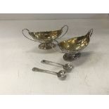 A pair of late George III silver boat shaped open salts of urn form with beaded decoration raised