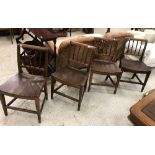 A set of four 19th Century Norfolk fruitwood slat-back dining chairs with shaped seats on square