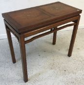 A modern Indian hardwood and brass inlaid fold-over tea table on square moulded supports,