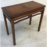 A modern Indian hardwood and brass inlaid fold-over tea table on square moulded supports,