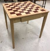 A modern French beech and stained beech chess table,