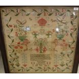 A Victorian needlework sampler decorated with Adam and Eve, flowers in vase, Cupids, stags,
