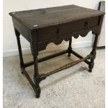 A 19th Century oak side table, the plank top with moulded edge over a single frieze drawer,