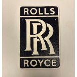 A modern painted cast iron sign inscribed "Rolls Royce",