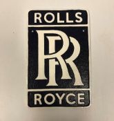 A modern painted cast iron sign inscribed "Rolls Royce",