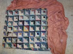 A vintage patchwork quilt mounted as a bedspread