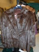 A brown mink jacket with satin lining,