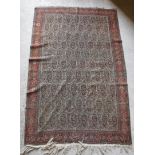 A fine Shenna rug with repeating leaf decoration on a cream ground,