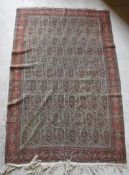 A fine Shenna rug with repeating leaf decoration on a cream ground,