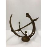 A modern iron armillary sphere sundial 46 cm high