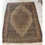 A Caucasian rug with blue stylised medallion decorated lozenge shaped medallion on a fawn / cream