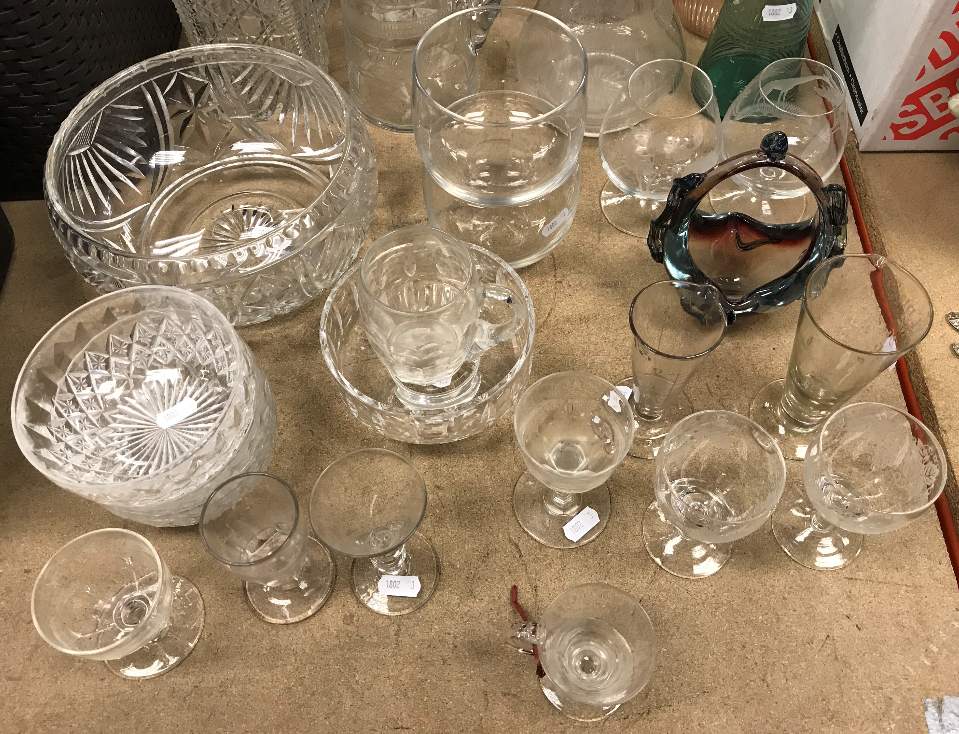 A collection of glassware to include a pair of hobnail cut decanters,