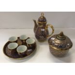 A Benjarong Design coffee pot tray, five teacups and a lidded bowl,