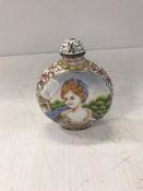 A Chinese enamel moon flask shaped snuff bottle decorate in the European manner with an elegant