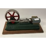 A Stuart Turner 550 type stationary steam engine, green painted with red painted fly wheel