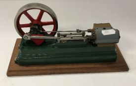 A Stuart Turner 550 type stationary steam engine, green painted with red painted fly wheel