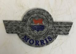 A modern painted cast metal sign "Morris",