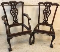 A set of eight 20th Century Chippendale style dining chairs with carved backs and drop-in seats (6