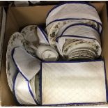 A box containing a Royal Doulton Larchmont part dinner service, to include dinner plates,