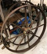 Two cast and wrought iron wheels,