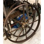Two cast and wrought iron wheels,