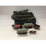 A Hornby O gauge 0-4-0 tank locomotive and Pullman coach,