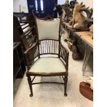 A circa 1900 mahogany framed elbow chair in the Art Nouveau manner,