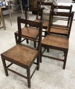 A set of five 19th Century oak bar back panel seat dining chairs on square supports united by