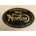 A modern painted cast iron sign inscribed "Norton",