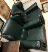 A pair of modern upholstered wing back scroll arm chairs in the circa 1900 style