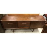 A 1970's Jentique teak sideboard, the plain top over three central drawers,