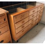 A stained beech and glazed haberdasher's counter with twelve show drawers and glazed front, 138.