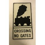 A modern painted cast metal sign "Crossing No Gates", 47.